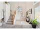 Bright foyer with staircase, tiled flooring, and natural light from large window above door at 1753 N St Francis Pl, Casa Grande, AZ 85122