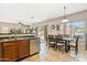 Cozy kitchen with stainless steel appliances, wood cabinets, and eat-in dining area at 1753 N St Francis Pl, Casa Grande, AZ 85122
