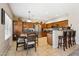 Eat-in kitchen with wooden cabinetry, granite counters, and tiled floors at 1753 N St Francis Pl, Casa Grande, AZ 85122