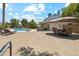 Backyard oasis with pool, dining area under umbrella, a lounge area, and mature landscaping at 18819 N 49Th Ave, Glendale, AZ 85308