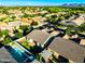 Aerial shot of the backyard and community with desert views in the background at 19598 E Walnut Rd, Queen Creek, AZ 85142