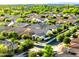 Wide aerial perspective of a community, showcasing neighborhood layout and lush landscaping at 19598 E Walnut Rd, Queen Creek, AZ 85142