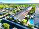 An aerial view of a vibrant community highlighting the backyard pool and a view of the desert mountains at 19598 E Walnut Rd, Queen Creek, AZ 85142