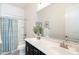 Clean bathroom featuring a vanity with a sink, a mirror, and a shower with a curtain at 19598 E Walnut Rd, Queen Creek, AZ 85142