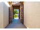 Inviting covered entryway showcasing stone detailing and a view of the front yard at 19598 E Walnut Rd, Queen Creek, AZ 85142