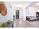 A welcoming foyer with neutral tones, stylish lighting, and archways leading to living spaces at 19598 E Walnut Rd, Queen Creek, AZ 85142