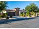 Charming single-story home featuring a desert landscape, stone accents, and a two-car garage at 19598 E Walnut Rd, Queen Creek, AZ 85142