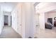 Bright hallway features carpet, natural light, and leads to various rooms, creating a welcoming atmosphere at 19598 E Walnut Rd, Queen Creek, AZ 85142