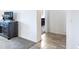 Hallway leading to bathroom with dark cabinets at 19598 E Walnut Rd, Queen Creek, AZ 85142