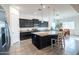 Well-appointed kitchen boasts granite countertops and dark wood cabinets at 19598 E Walnut Rd, Queen Creek, AZ 85142