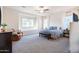 Bright main bedroom with large windows and neutral decor at 19598 E Walnut Rd, Queen Creek, AZ 85142