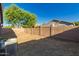 A spacious, private backyard featuring brick walls, and desert landscaping at 20919 E Desert Hills Blvd, Queen Creek, AZ 85142