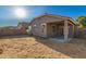 Back yard with a desert landscape, a patio, and a covered area at 20919 E Desert Hills Blvd, Queen Creek, AZ 85142