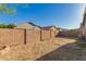 Spacious backyard features a brick wall and a landscaping bed at 20919 E Desert Hills Blvd, Queen Creek, AZ 85142