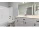 Clean bathroom featuring a shower and tub combination, a vanity with white cabinets and a large mirror at 20919 E Desert Hills Blvd, Queen Creek, AZ 85142