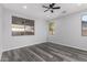 Bedroom featuring recessed lighting, windows with neighborhood views and gray vinyl floors at 20919 E Desert Hills Blvd, Queen Creek, AZ 85142