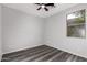 Bright bedroom featuring a window overlooking mature trees at 20919 E Desert Hills Blvd, Queen Creek, AZ 85142
