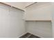 Walk-in closet offering built-in wooden shelving at 20919 E Desert Hills Blvd, Queen Creek, AZ 85142