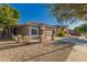 Beautiful exterior showcasing stone accents, a tile roof, and desert landscaping at 20919 E Desert Hills Blvd, Queen Creek, AZ 85142