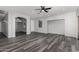 Large living room showcasing wood floors, archway, and recessed lighting at 20919 E Desert Hills Blvd, Queen Creek, AZ 85142