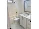 Bathroom featuring a modern vanity with white hardware and tiled shower at 2114 N 94Th Ave, Phoenix, AZ 85037