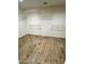 Walk-in closet with hardwood floors and wire shelving at 2114 N 94Th Ave, Phoenix, AZ 85037