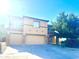 Inviting two-story home featuring a two-car garage, desert landscaping, and a charming, covered entryway at 2114 N 94Th Ave, Phoenix, AZ 85037