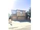 Two-story home featuring a three-car garage and neutral color palette at 2114 N 94Th Ave, Phoenix, AZ 85037