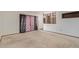 This living room features carpet and partial room divider at 2138 W Northview Ave, Phoenix, AZ 85021