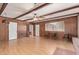 Spacious living room with wood paneling, laminate flooring and windows providing ample natural light at 2138 W Northview Ave, Phoenix, AZ 85021