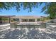 Expansive backyard with tiled patio, pool, and a charming tiled water feature for outdoor enjoyment at 2859 E Los Altos Rd, Gilbert, AZ 85297