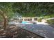 Lush backyard showcasing the pool, water features, patio, and beautifully landscaped greenery at 2859 E Los Altos Rd, Gilbert, AZ 85297