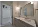 Bright bathroom features double vanity sinks, pendant lighting, and two large mirrors at 2859 E Los Altos Rd, Gilbert, AZ 85297