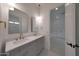 This bright bathroom features double vanity sinks, pendant lighting, and large mirrors at 2859 E Los Altos Rd, Gilbert, AZ 85297
