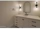 Bright bathroom with white cabinets, black hardware, and ample storage at 2859 E Los Altos Rd, Gilbert, AZ 85297