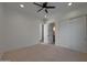 Bright bedroom with a ceiling fan, carpeted floors, and white trim at 2859 E Los Altos Rd, Gilbert, AZ 85297