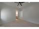 Bedroom showcasing modern ceiling fan and views to an ensuite bathroom at 2859 E Los Altos Rd, Gilbert, AZ 85297
