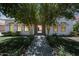 Charming single-story home with manicured lawn and inviting brick pathway at 2859 E Los Altos Rd, Gilbert, AZ 85297