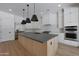 Spacious kitchen island with custom cabinetry and modern lighting fixtures at 2859 E Los Altos Rd, Gilbert, AZ 85297