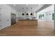 Open kitchen design with stainless steel appliances and custom kitchen island at 2859 E Los Altos Rd, Gilbert, AZ 85297