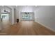 Bright and spacious living room with hardwood floors, fireplace, and backyard views at 2859 E Los Altos Rd, Gilbert, AZ 85297