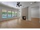 Bright living room with a fireplace and views of the backyard pool area at 2859 E Los Altos Rd, Gilbert, AZ 85297