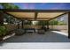 Relaxing outdoor patio with a covered pergola, seating, and a grill, ideal for gatherings at 2859 E Los Altos Rd, Gilbert, AZ 85297