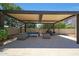 Outdoor patio area offering comfortable seating under a shaded pergola, perfect for relaxation at 2859 E Los Altos Rd, Gilbert, AZ 85297