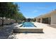 Stunning backyard pool and spa with mosaic tiling, water feature, and manicured landscaping at 2859 E Los Altos Rd, Gilbert, AZ 85297