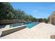 Backyard pool and spa area with tiled accents, water feature, and inviting blue and white umbrellas at 2859 E Los Altos Rd, Gilbert, AZ 85297