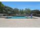 Stunning pool area with stone deck, water features, and lush landscaping at 2859 E Los Altos Rd, Gilbert, AZ 85297