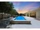 Inviting backyard pool and spa with lush landscaping, perfect for relaxation and outdoor enjoyment at 2859 E Los Altos Rd, Gilbert, AZ 85297