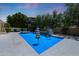 Inviting pool with umbrellas and a serene backyard setting for outdoor enjoyment at 2859 E Los Altos Rd, Gilbert, AZ 85297