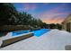 Stunning pool and spa area in a meticulously landscaped backyard with a covered patio at 2859 E Los Altos Rd, Gilbert, AZ 85297